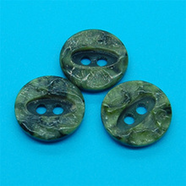 Green round plastic shirt button
